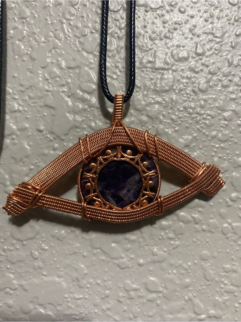 Handcrafted eye of Horus Copper Wire Pendant with Amethyst Center